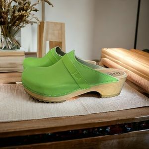 Never worn, perfect condition, bright green clogs; no box